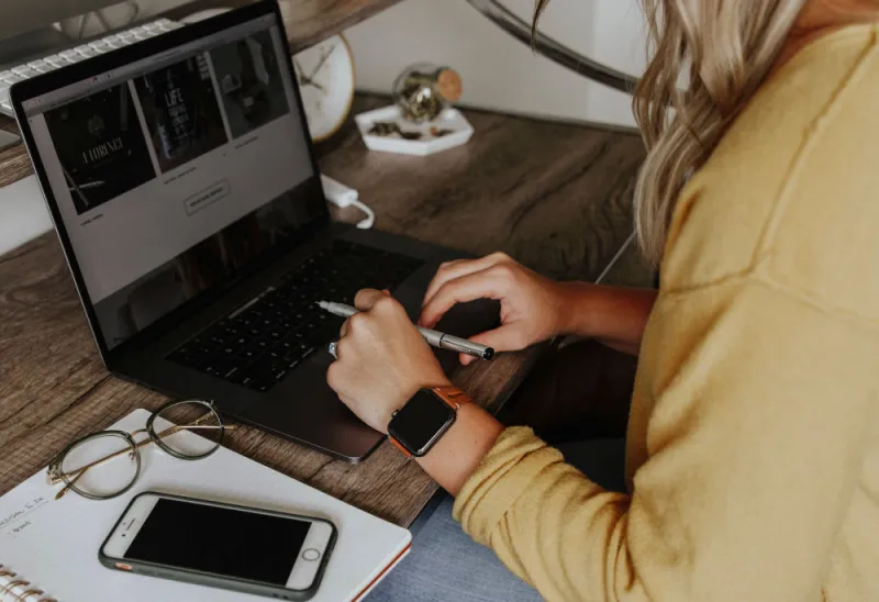 female-sat-at-a-desk-working-from-home female-sat-at-a-desk-working-from-home
