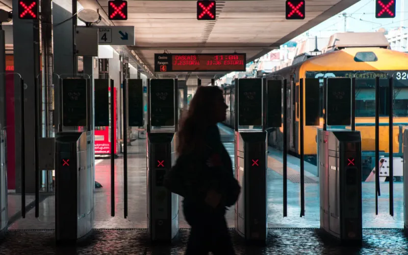 woman-walking-across-train-platform woman-walking-across-train-platform