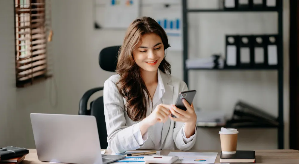 Lady happy using NHS app Lady happy using NHS app