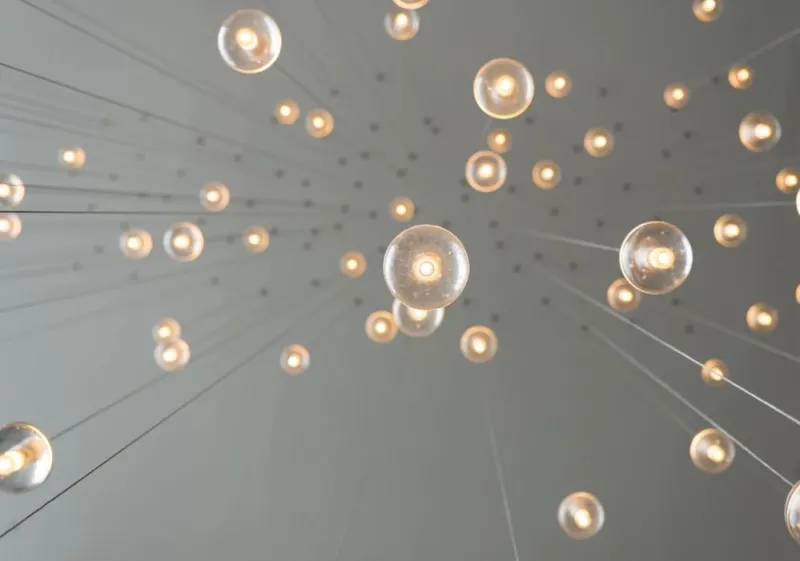 light bulbs dangling from ceiling representing new ideas