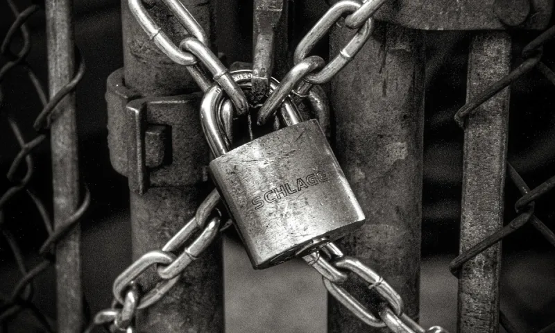 padlock image on a gate, representing security