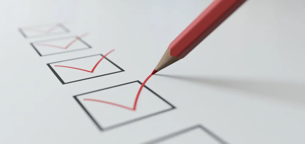 A pencil putting ticks in boxes as a checklist A pencil putting ticks in boxes as a checklist