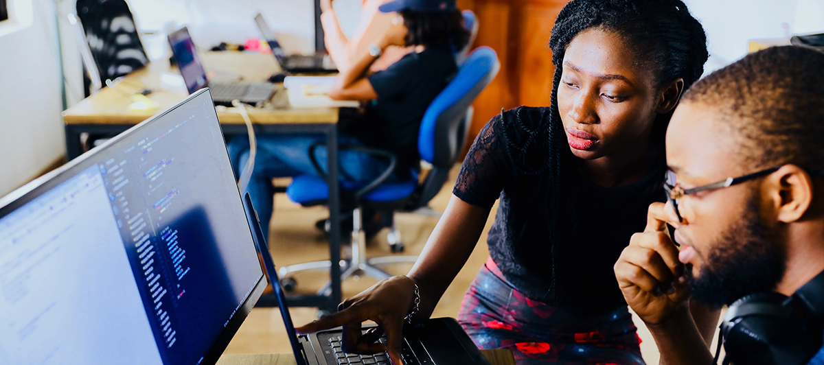two people learning to code