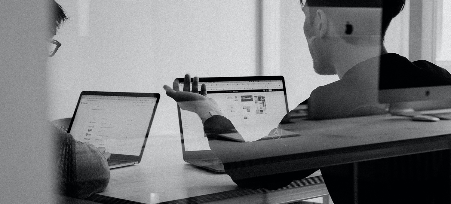 two developers working together at a micro agency